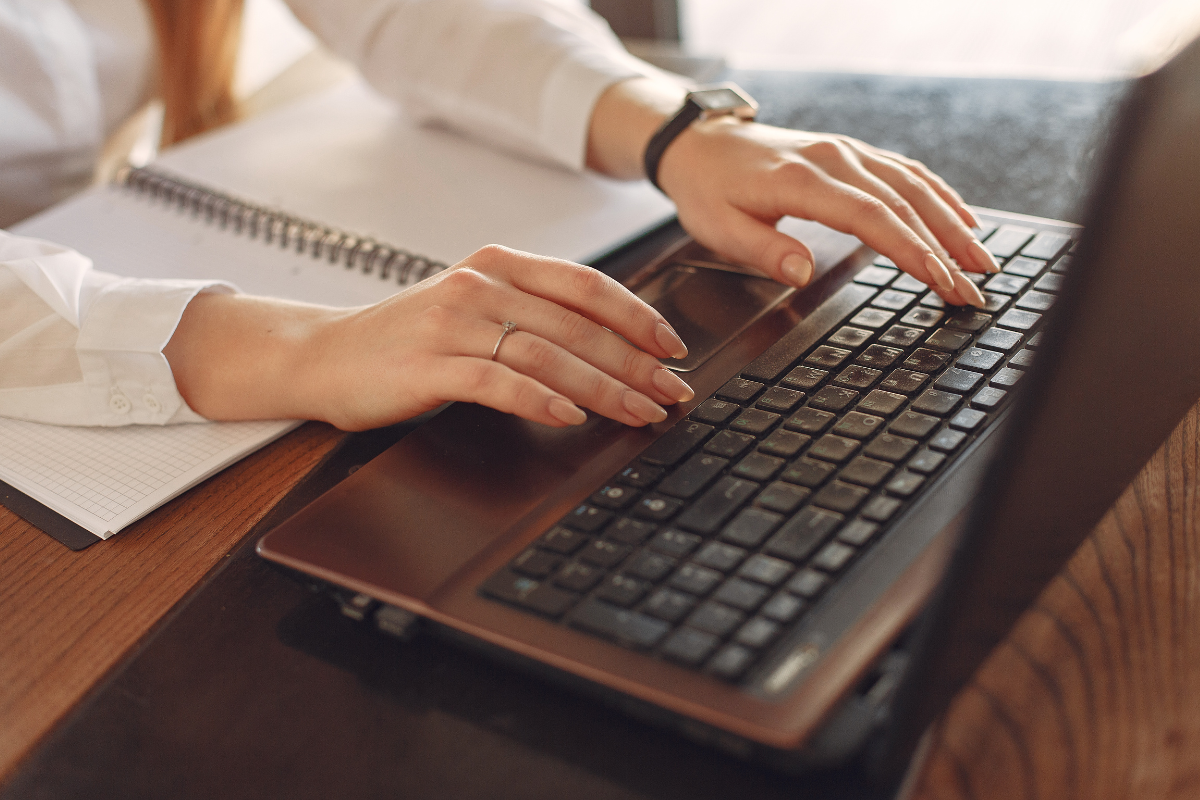 Lady typing on a computer